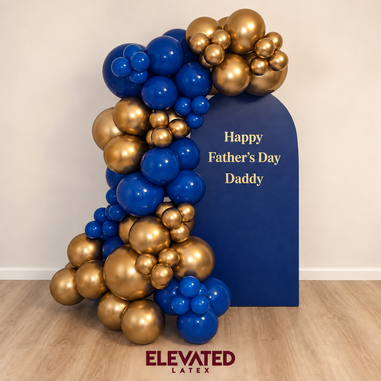 Navy and chrome gold balloon garland on an arch backdrop